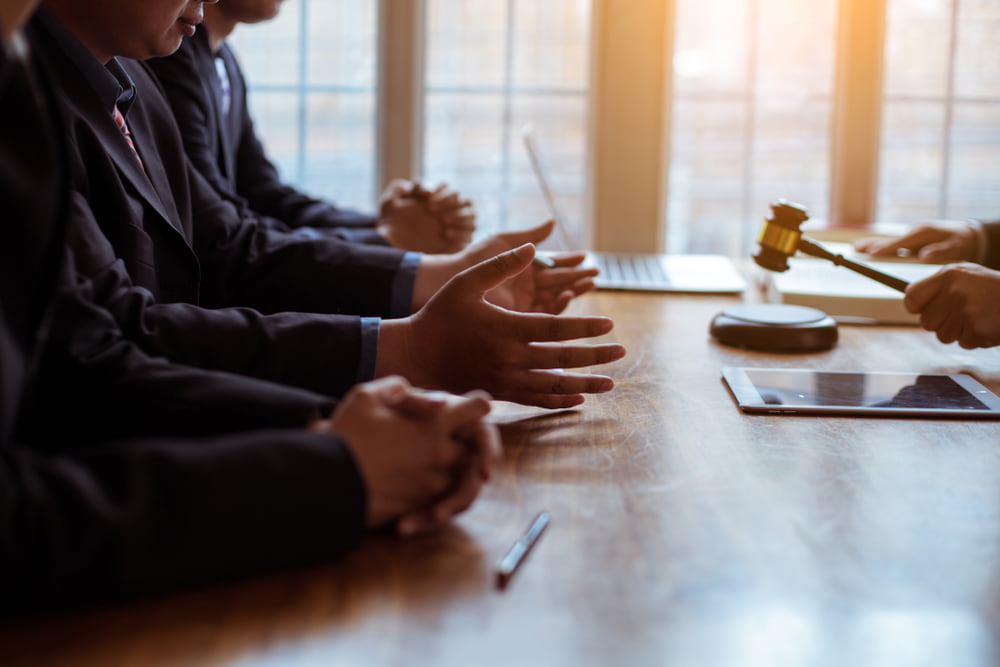 attorney mediates lawsuit between parties in workplace